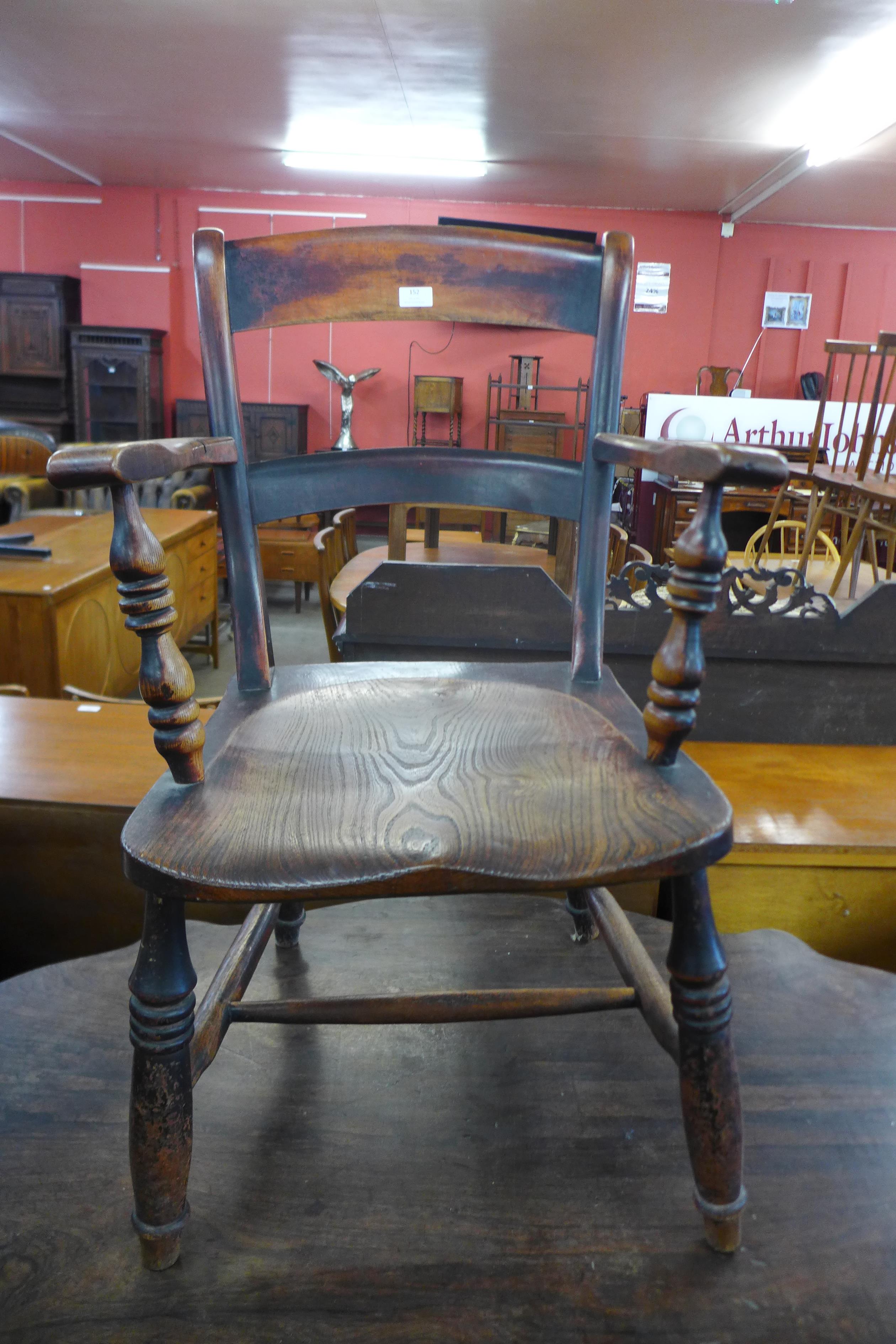 A Victorian elm and beech elbow chair