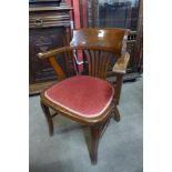 An early 20th Century oak desk chair