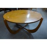 A teak circular coffee table