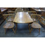 An Ercol Blonde elm and beech Windsor drop-leaf table and four 376 model candlestick back chairs