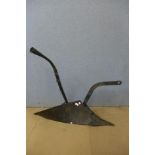 A vintage French wrought iron plough