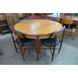 A G-Plan Fresco teak extending dining table and four chairs