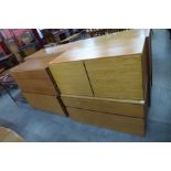 Four teak wall mounted cabinets