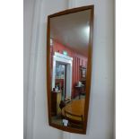 A teak framed mirror