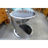 A chrome and black glass circular two tier coffee table