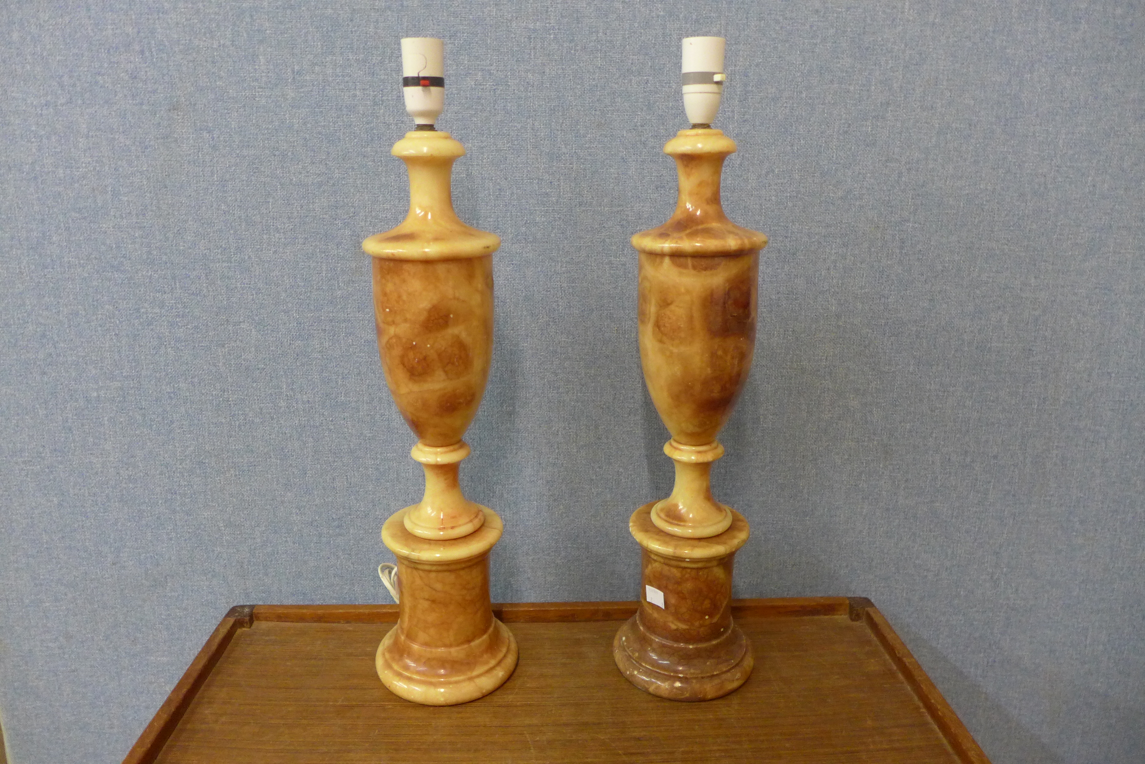 A pair of marble table lamps