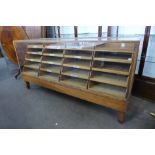 An oak twenty drawer haberdashery shop cabinet