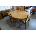 A G-Plan Fresco teak extending dining table and four chairs