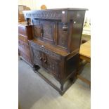 A small carved oak court cupboard