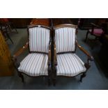 A pair of 19th Century French Empire style mahogany and upholstered fauteuils