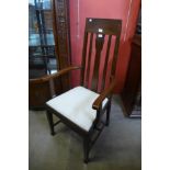 An Arts and Crafts oak armchair