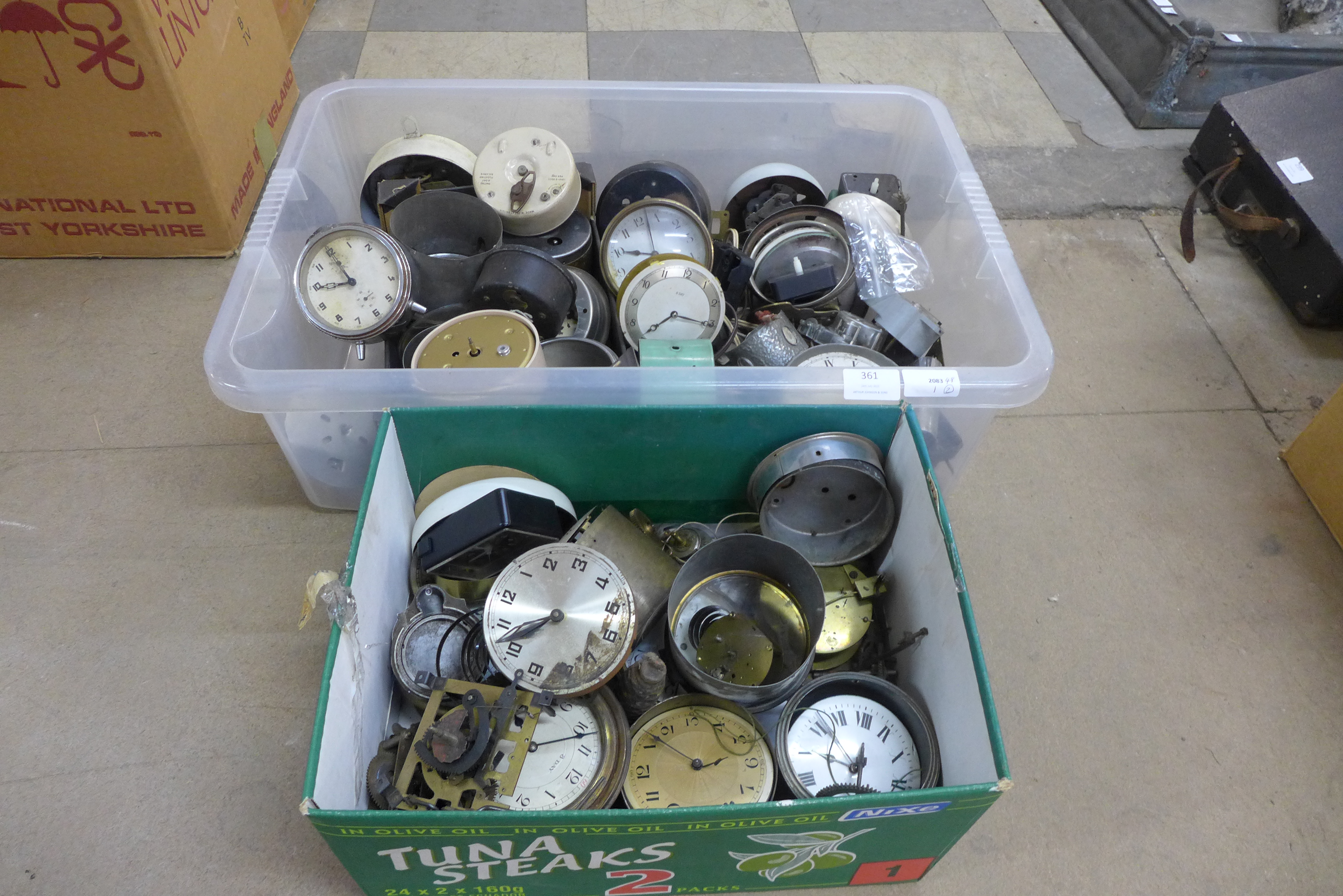 Two boxes of clocks and parts