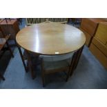 A McIntosh teak extending dining table and four chairs