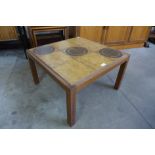 A teak and tiled top square coffee table