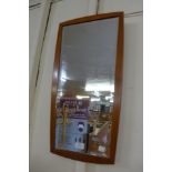 A teak framed mirror