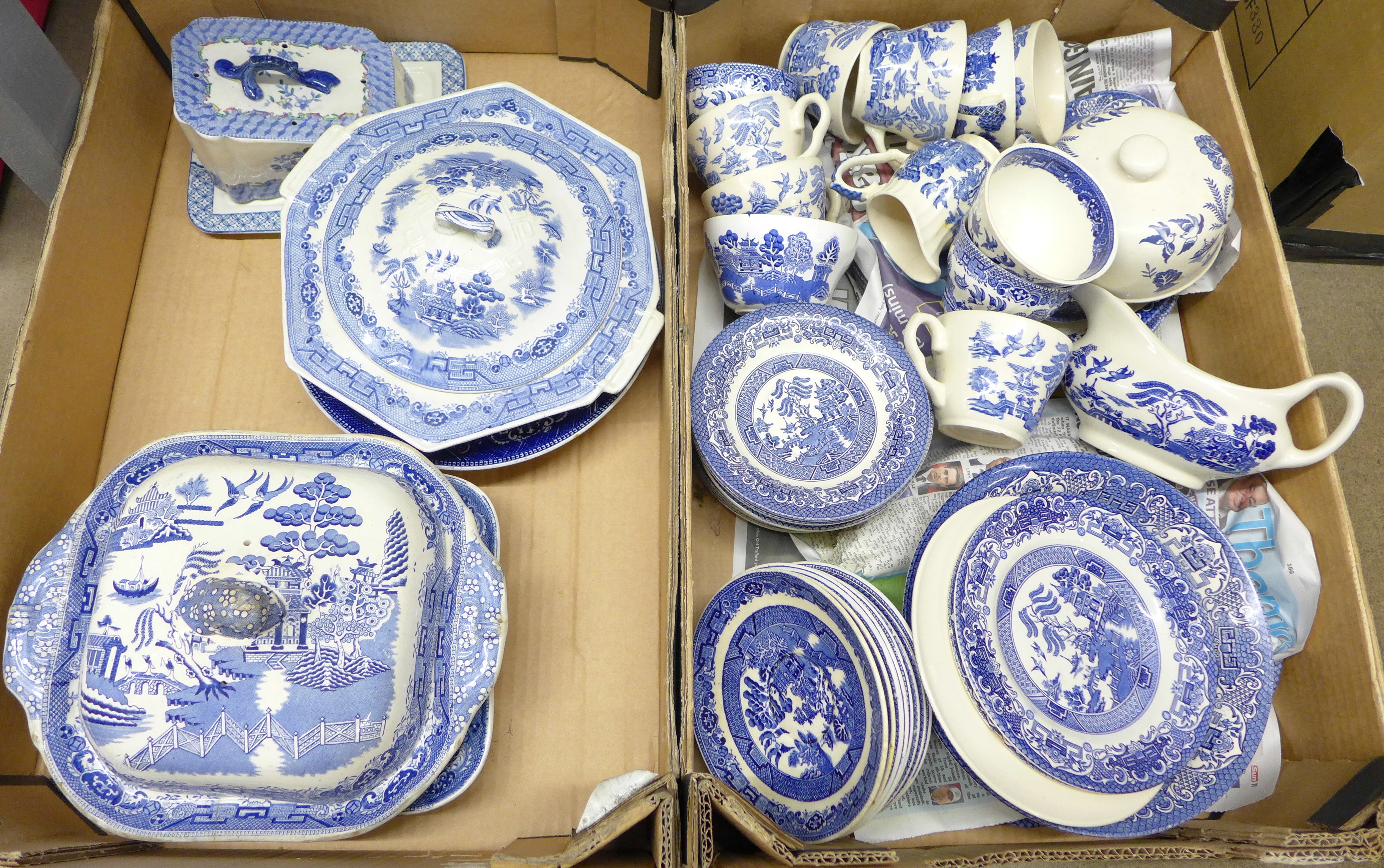 Two boxes of blue and white Willow pattern china, including tureens, cups, saucers, bowls, etc. **