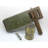 A WWII rattle, ARP whistle and a tin of dried eggs