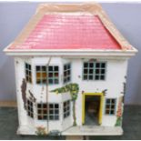 A tin plate and wooden doll's house with furniture, 41cm, roof a/f