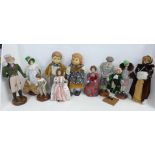 A pair of Goebel style boy and girl dolls, 26cm and Teresa Thompson and other dolls