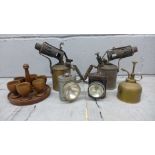 Two blow lamps, Primus and Sievert, two bicycle lamps, an oil can and six egg cups on stand **PLEASE