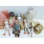 A small collection of bisque dolls and a half doll