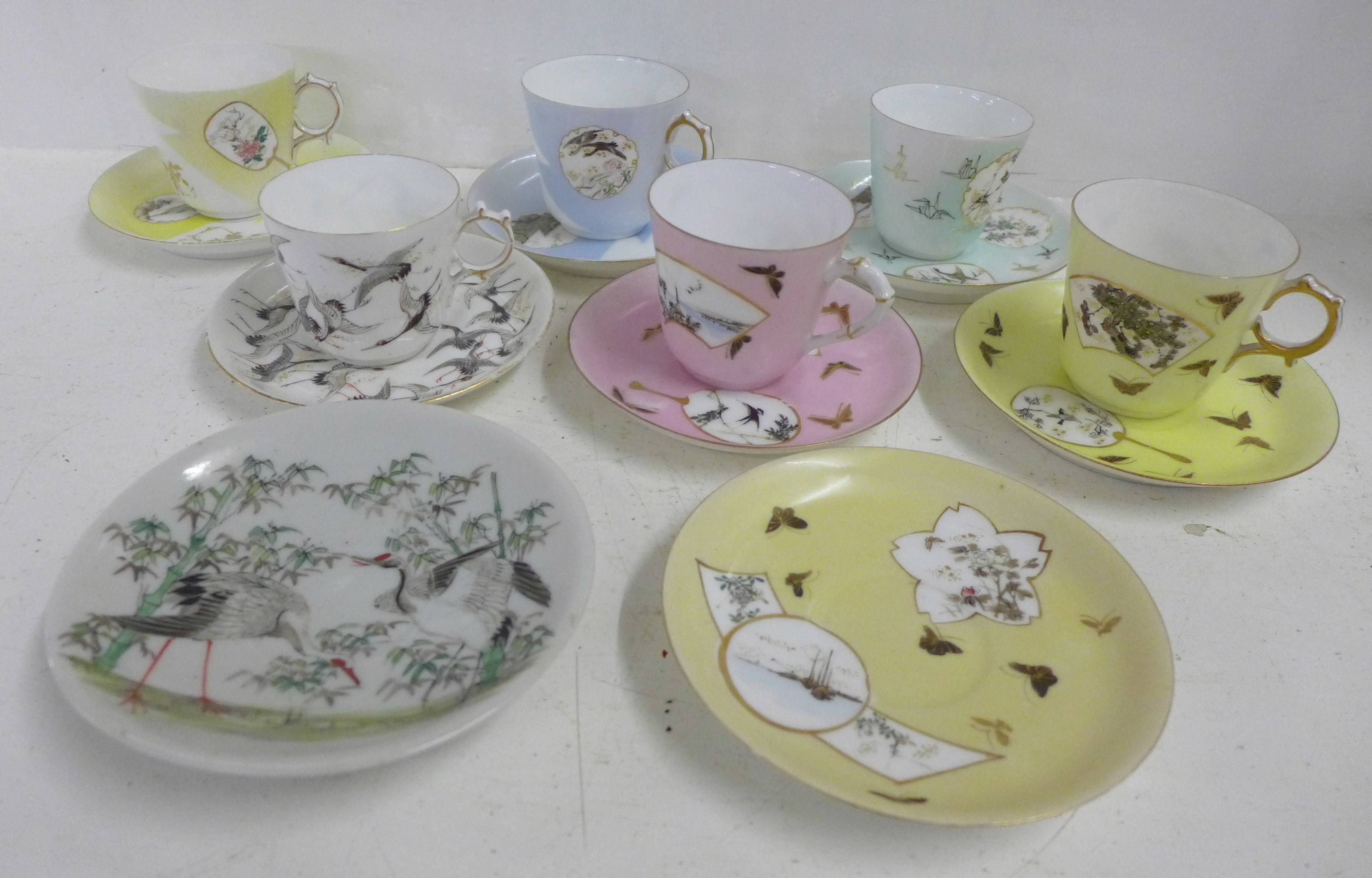 Six oriental cups and saucers and a plate