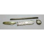 A silver cased watch, a/f, a Victorian silver handle, a silver comb back and a silver and mother