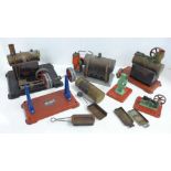 A collection of three steam engines including two Mamod, line shaft and other pulley wheels and
