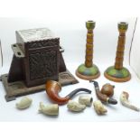 A Black Forest carved pipe stand tobacco box, two pipes and clay pipe bowls and a pair of painted