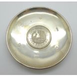 A silver dish set with £5 coin insert