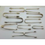 Ten pairs of silver sugar tongs, 284g, and one plated pair