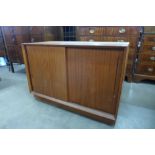 A teak two door cabinet