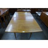 A teak extending dining table