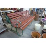 A wrought iron ended garden bench