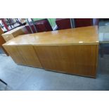 Four teak office cabinets and a table