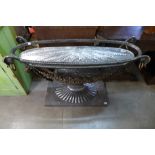 An Italian style steel urn shaped console table, a/f, lacking glass top