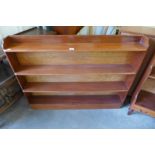 A mahogany waterfall open bookcase and one other