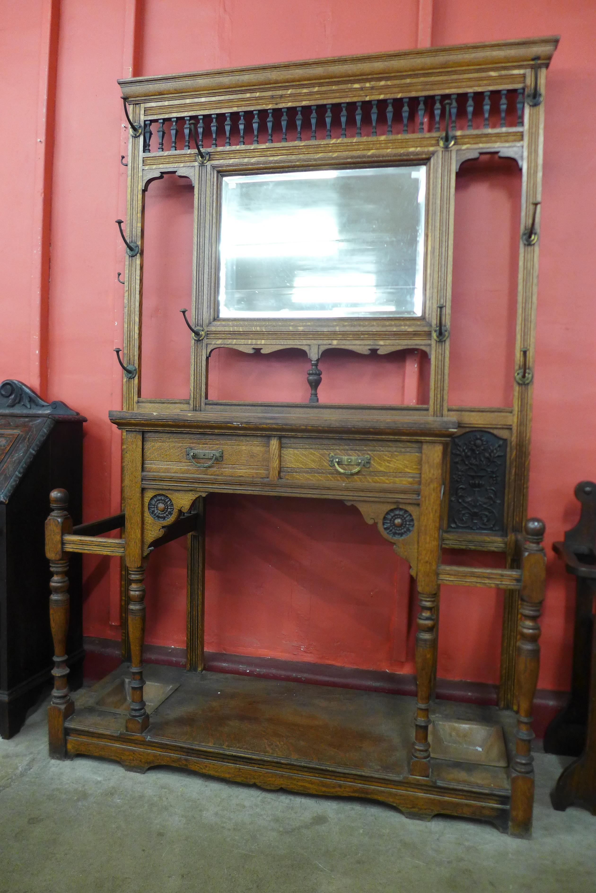 A large Victorian Aesthetic Movement carved oak hallstand