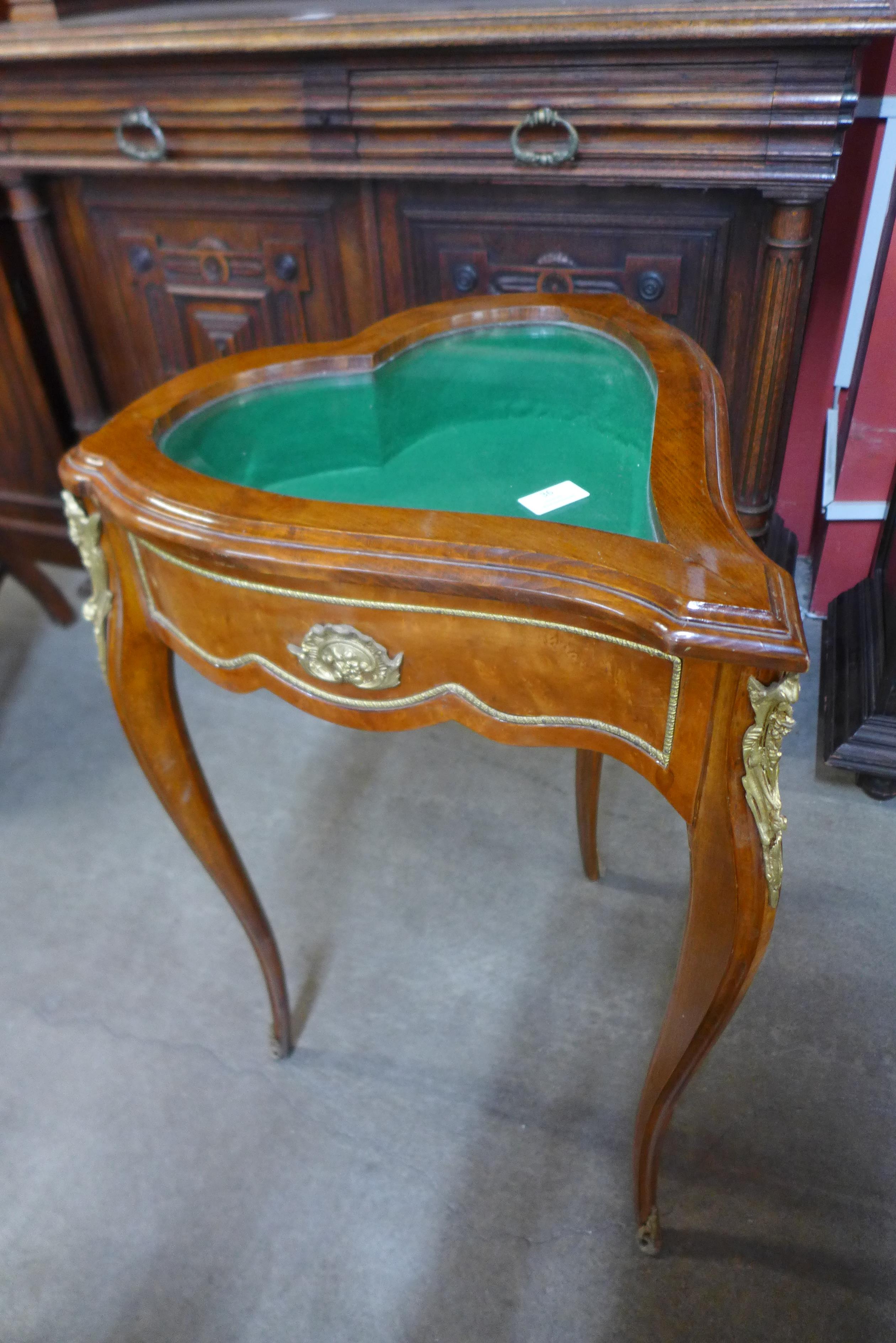 A French Louis XV style walnut and gilt metal mounted heart shaped bijouterie table