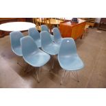A set of seven Charles & Ray Eames chrome and perspex Vitra chairs