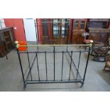 A Victorian cast iron and brass double bed