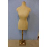 A vintage mannequin on stand