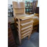A set of six beech and plywood stacking chairs