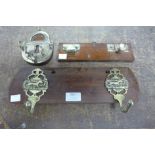 Two vintage coat hooks and a lock shaped key rack