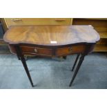 A mahogany serpentine two drawer side table