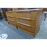 A teak chest of drawers