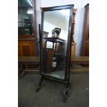 An Edward VII oak cheval mirror