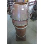 A Victorian saltglazed terracotta chimney pot