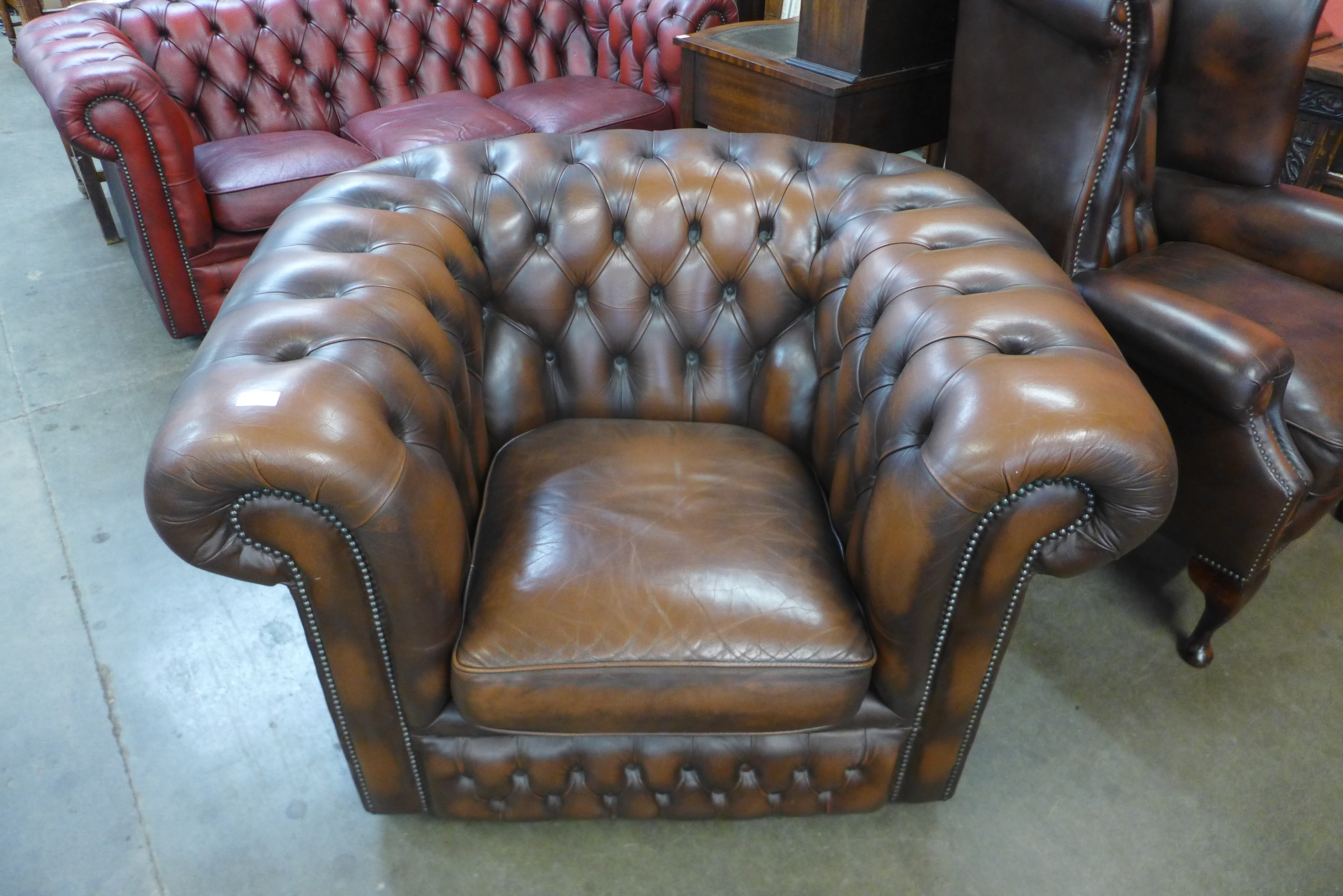 A brown leather gentleman's club chair