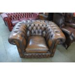 A brown leather gentleman's club chair